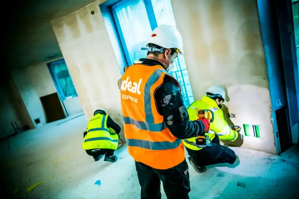 Installing drying equipment in a commercial building.