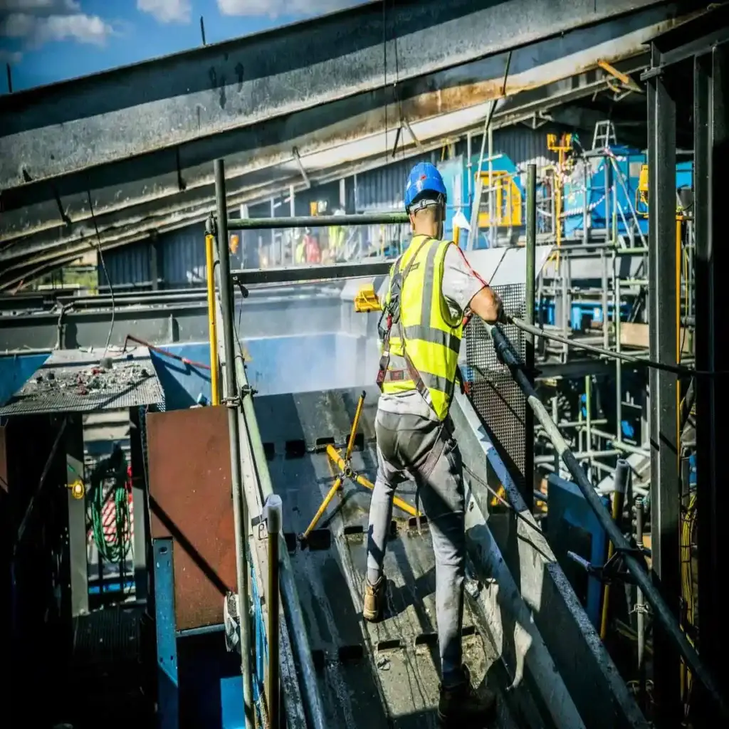 Person cleaning a fire damaged building